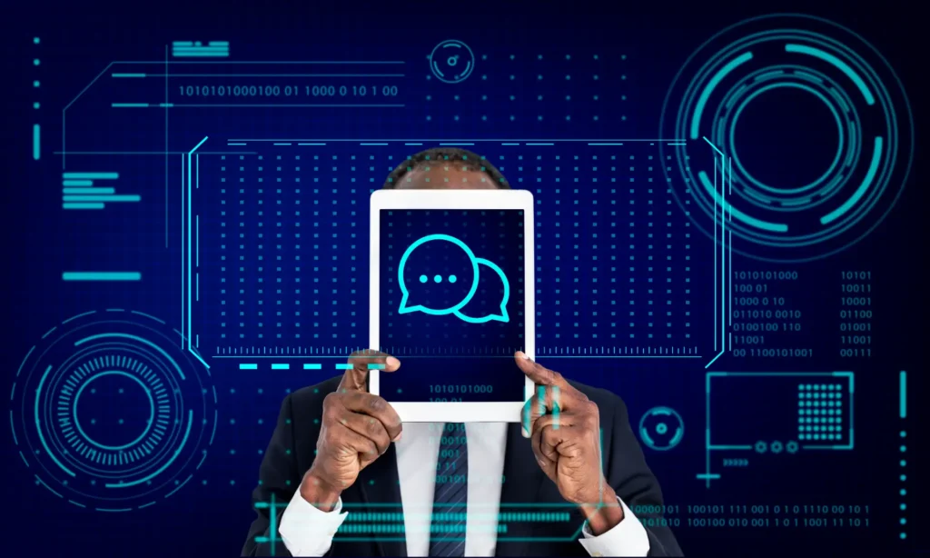 Ilustração futurista de um homem usando computador com um ícone de chat holográfico, cercado por circuitos e dados, sugerindo navegação agêntica e comunicação inteligente em ambiente digital.